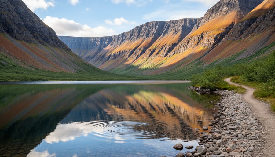 Trout River Pond shoreline with a docked boat and distant fjord and Tablelands views